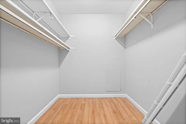 a view of a room with wooden floor