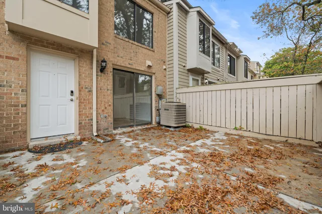 a view of backyard with large trees