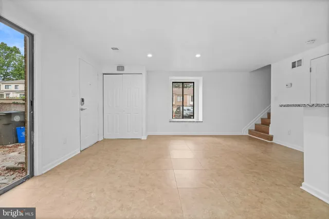 a view of an empty room with a window