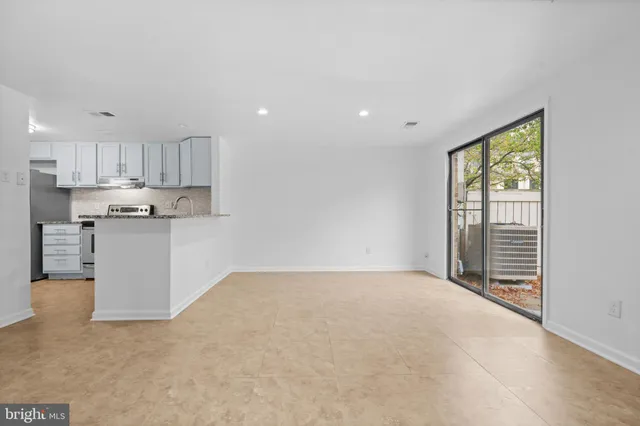 a view of a kitchen with microwave and cabinets