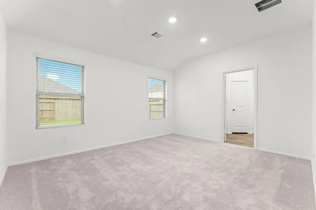 a kitchen with white cabinets appliances and sink