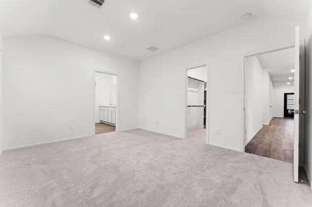 a kitchen with stainless steel appliances granite countertop a sink and a stove