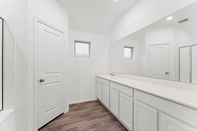 a kitchen with a sink and a stove top oven