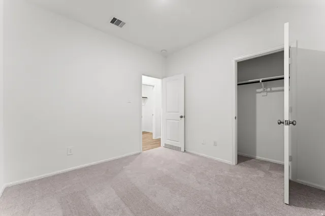 a room with a sink and a mirror