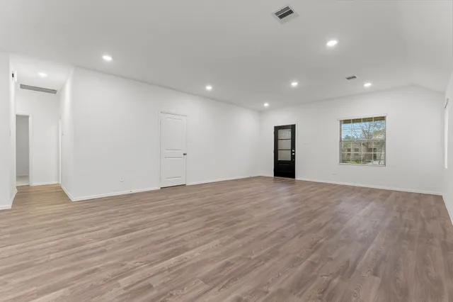 a view of kitchen with wooden floor and electronic appliances