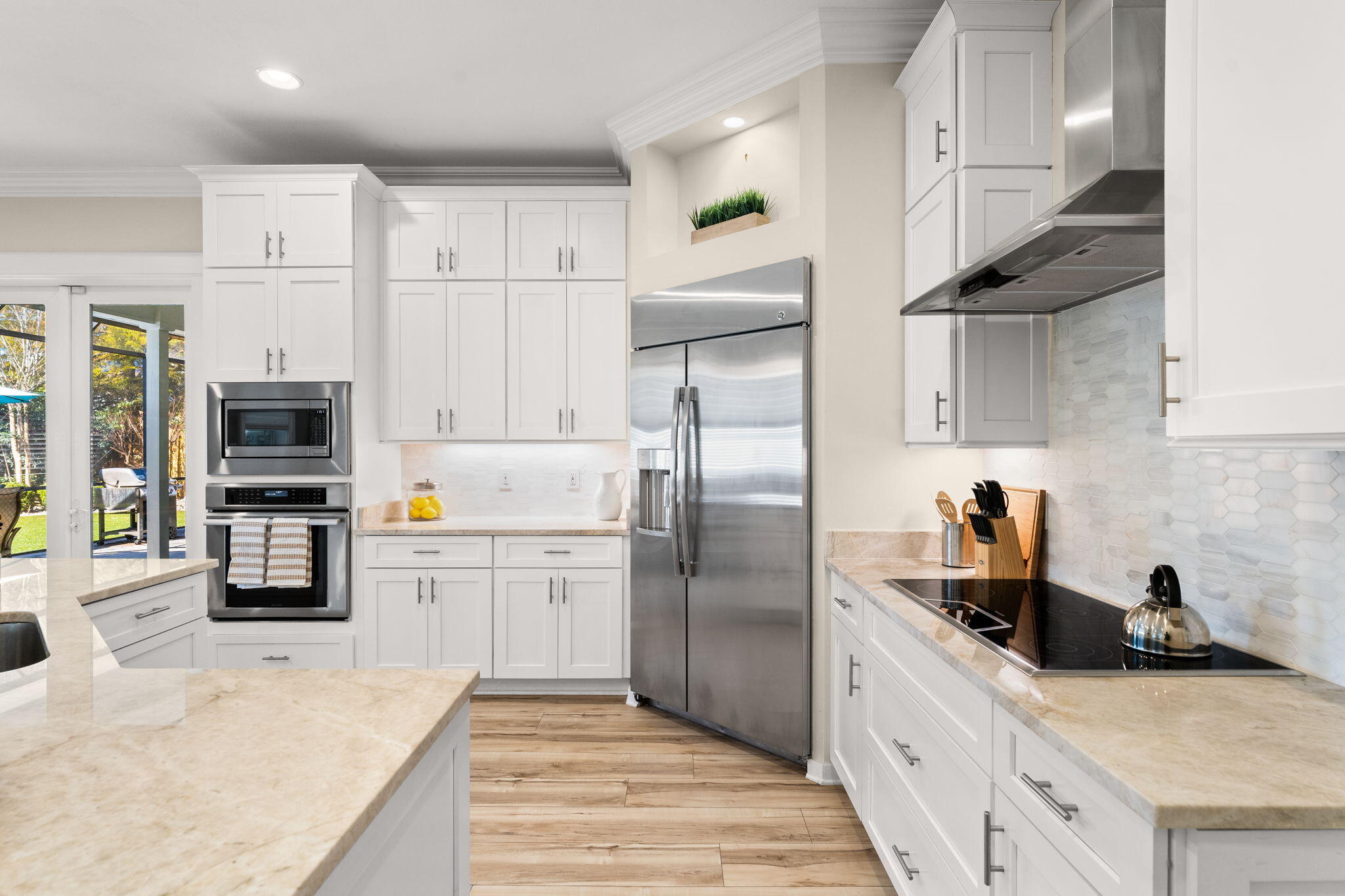 81 Botany Boulevard Santa Rosa Beach, FL 32459 - Photo 11 of 62 a kitchen with stainless steel appliances a refrigerator sink and cabinets
