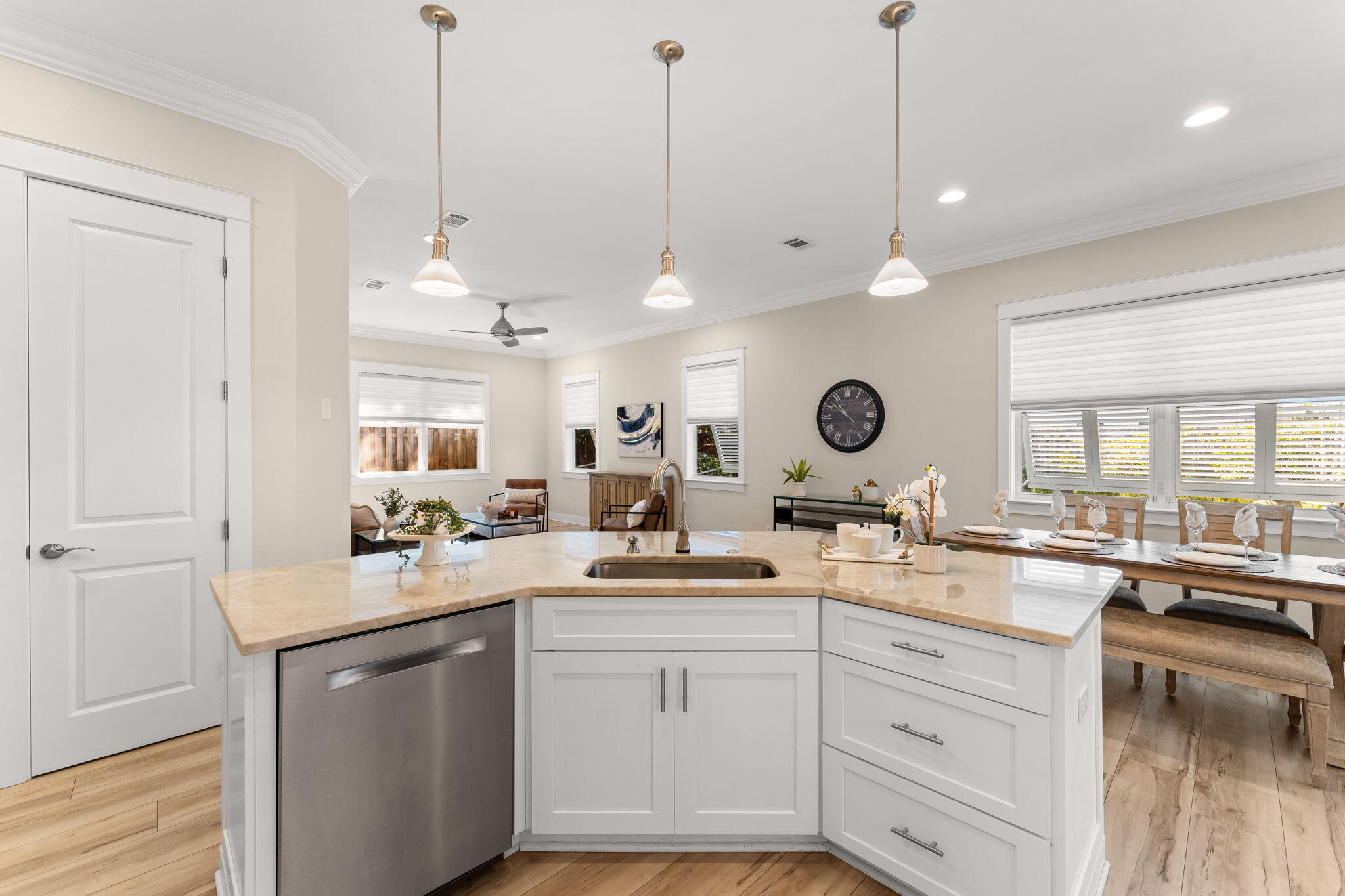 81 Botany Boulevard Santa Rosa Beach, FL 32459 - Photo 14 of 62 a kitchen with a sink dishwasher and white cabinets with wooden floor