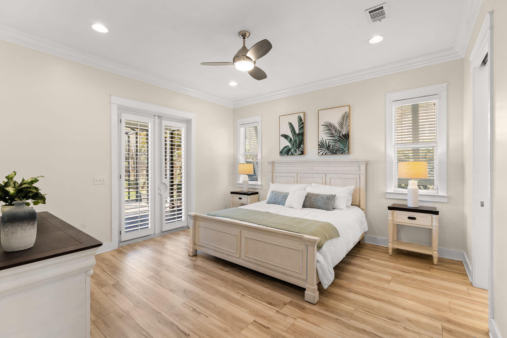 81 Botany Boulevard Santa Rosa Beach, FL 32459 - Photo 21 of 62 a bedroom with a large bed and a chandelier