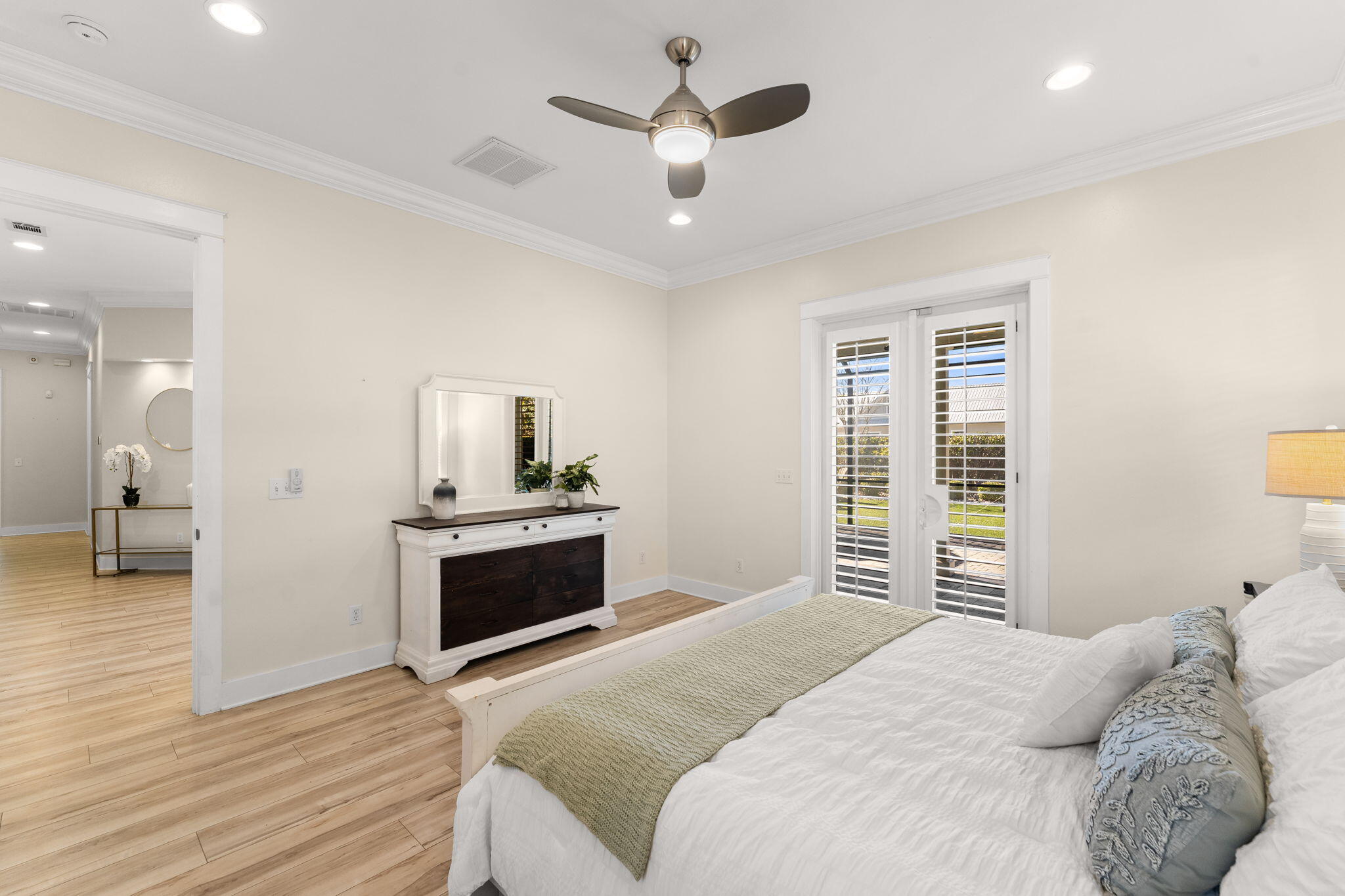 81 Botany Boulevard Santa Rosa Beach, FL 32459 - Photo 22 of 62 a bedroom with a bed and a chandelier