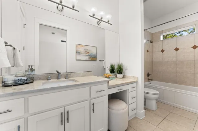 a bathroom with a sink a mirror and shower