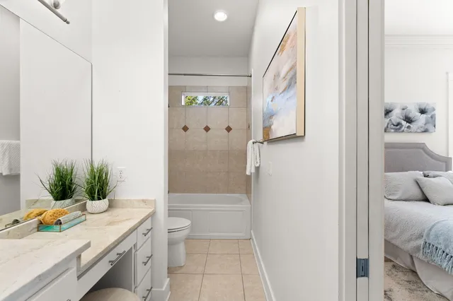 a bedroom with two beds and a couch