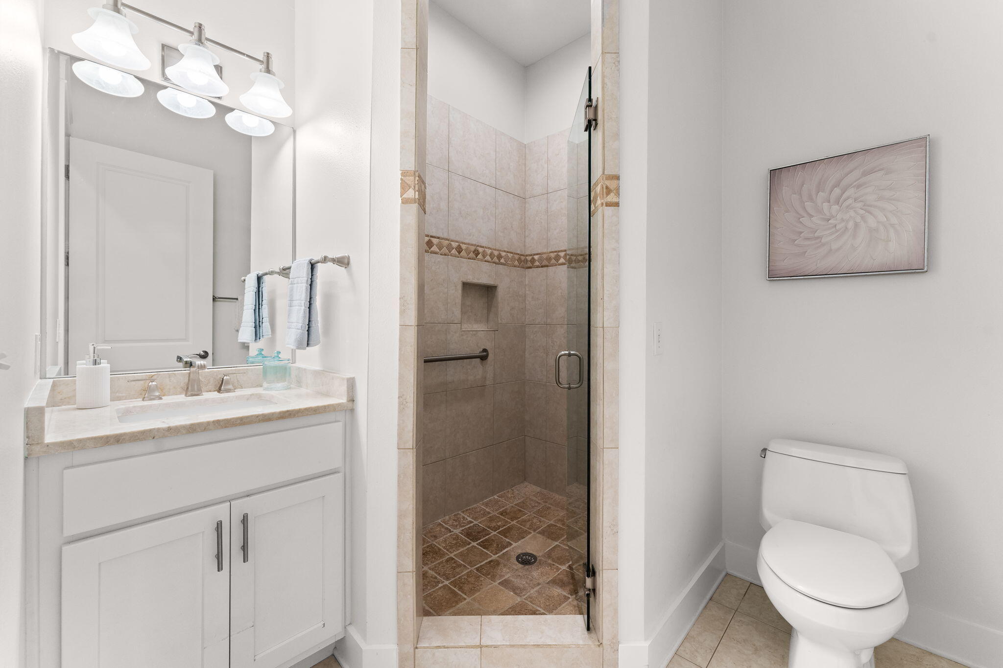 81 Botany Boulevard Santa Rosa Beach, FL 32459 - Photo 33 of 62 a bathroom with a sink a toilet and shower