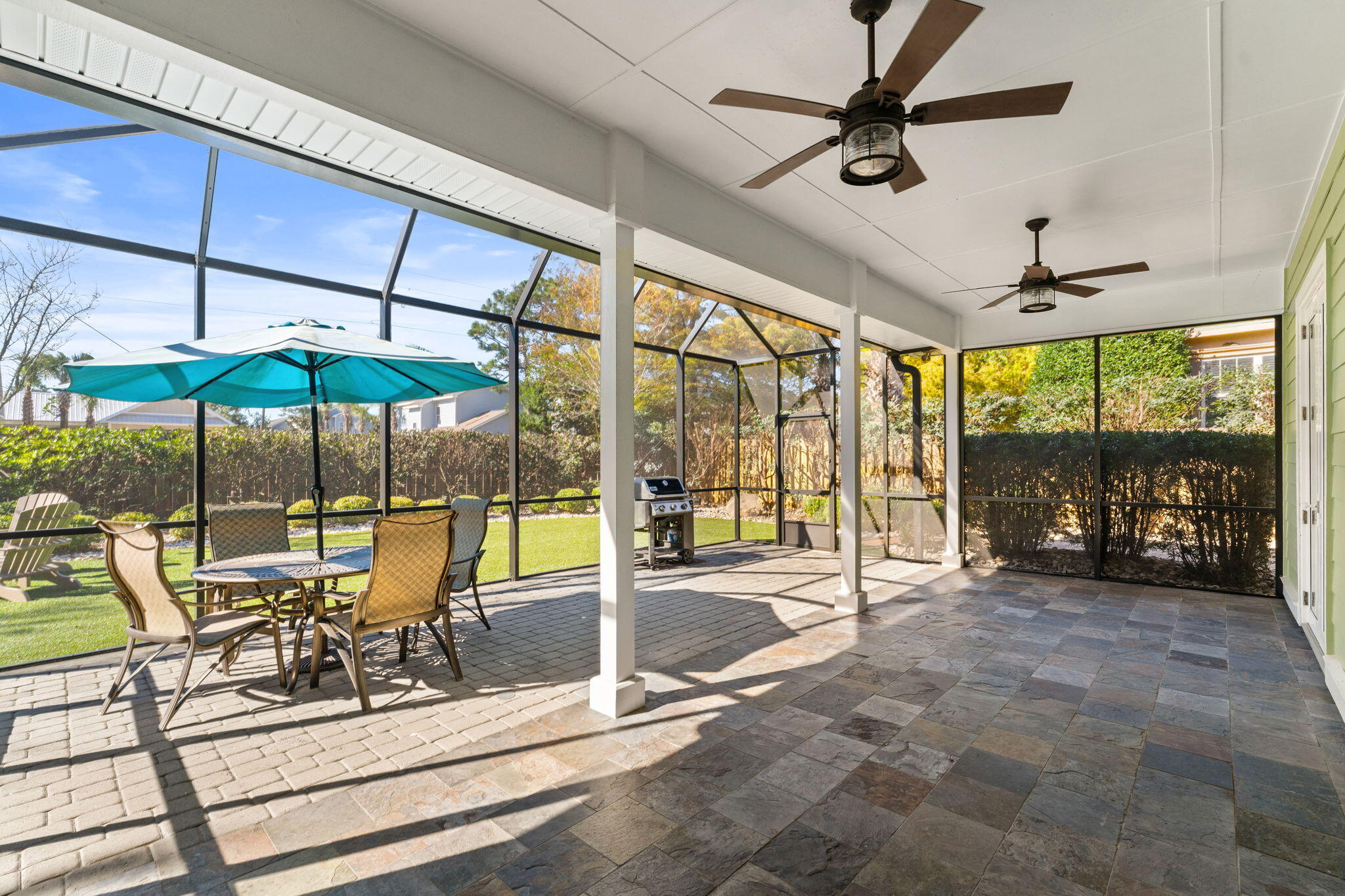 81 Botany Boulevard Santa Rosa Beach, FL 32459 - Photo 40 of 62 a view of a dining room with furniture water and a floor to ceiling window