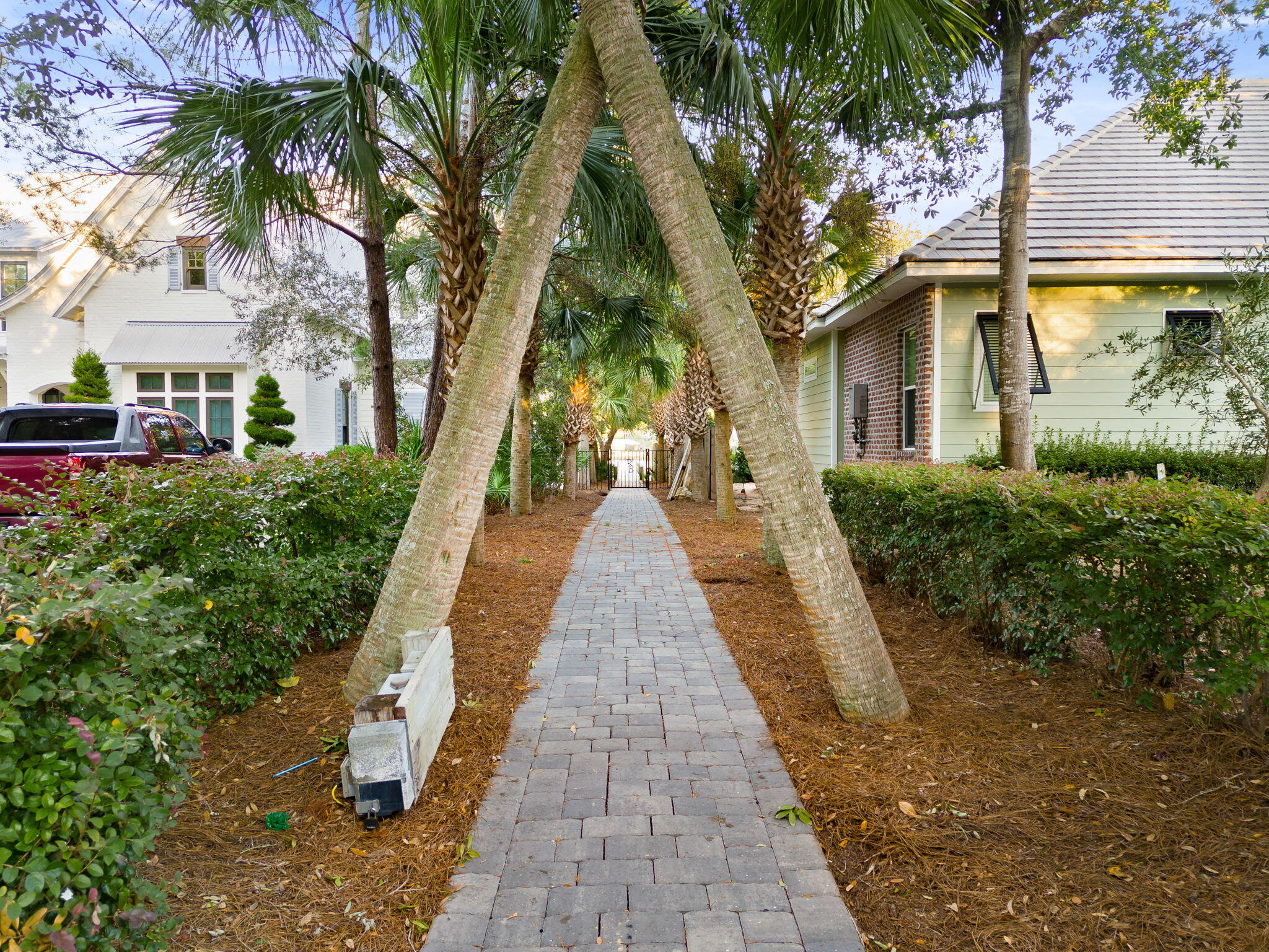 81 Botany Boulevard Santa Rosa Beach, FL 32459 - Photo 57 of 62 a view of a brick house with large trees