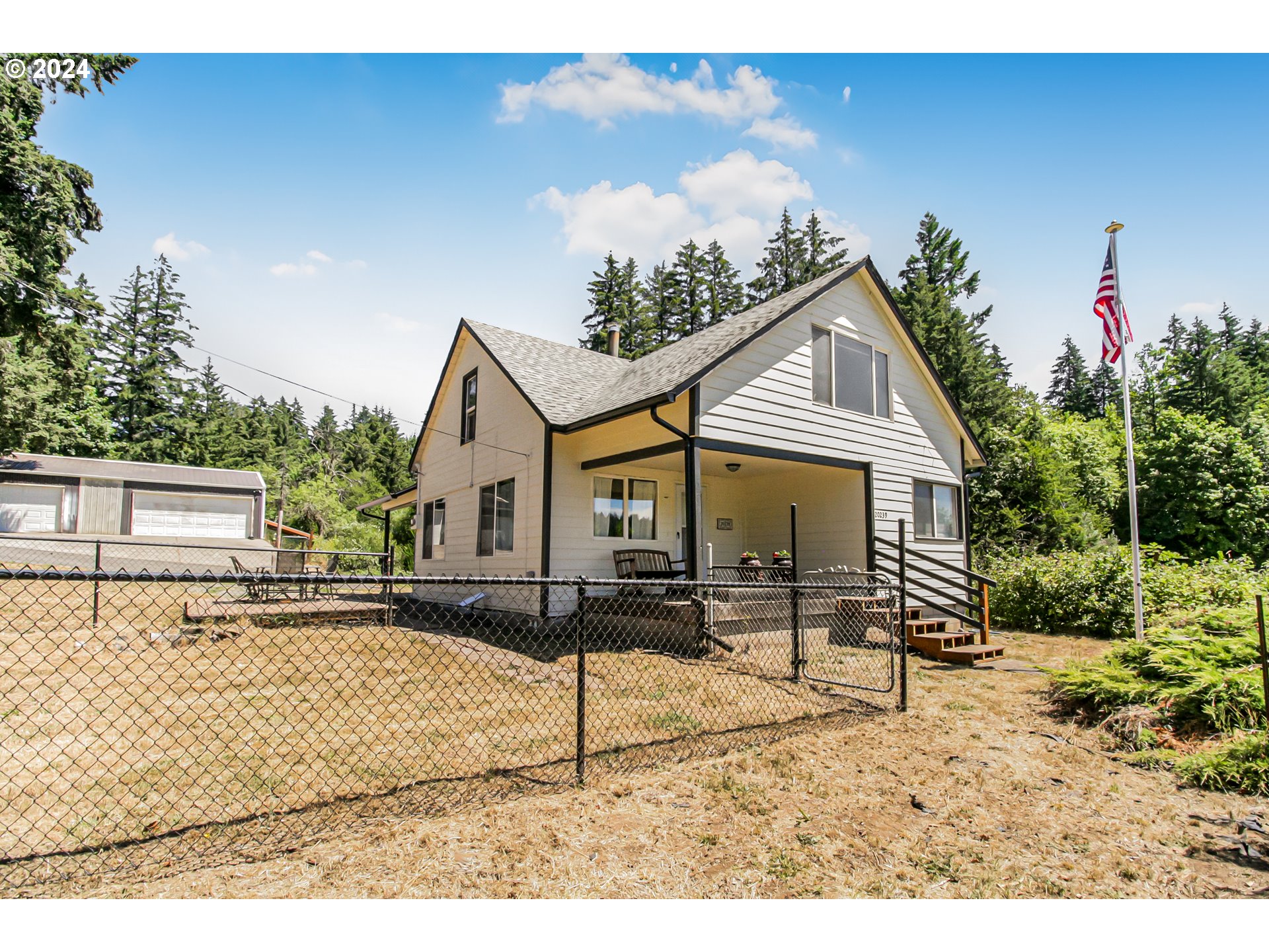 20239 Northwest Pihl Road Banks, OR 97106 - Photo 1 of 35 a front view of a house with a yard