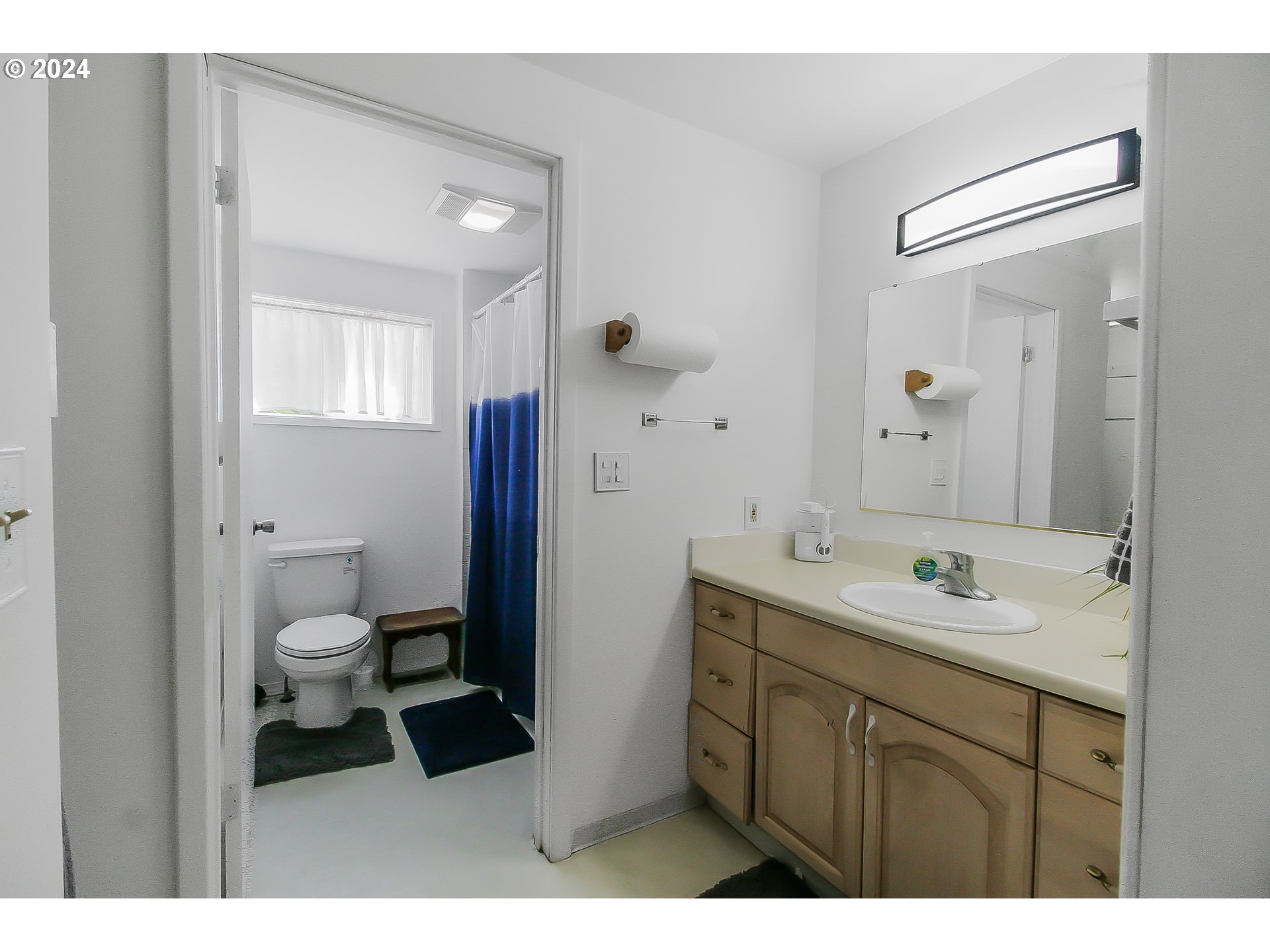 20239 Northwest Pihl Road Banks, OR 97106 - Photo 15 of 35 a bathroom with a toilet a sink and mirror