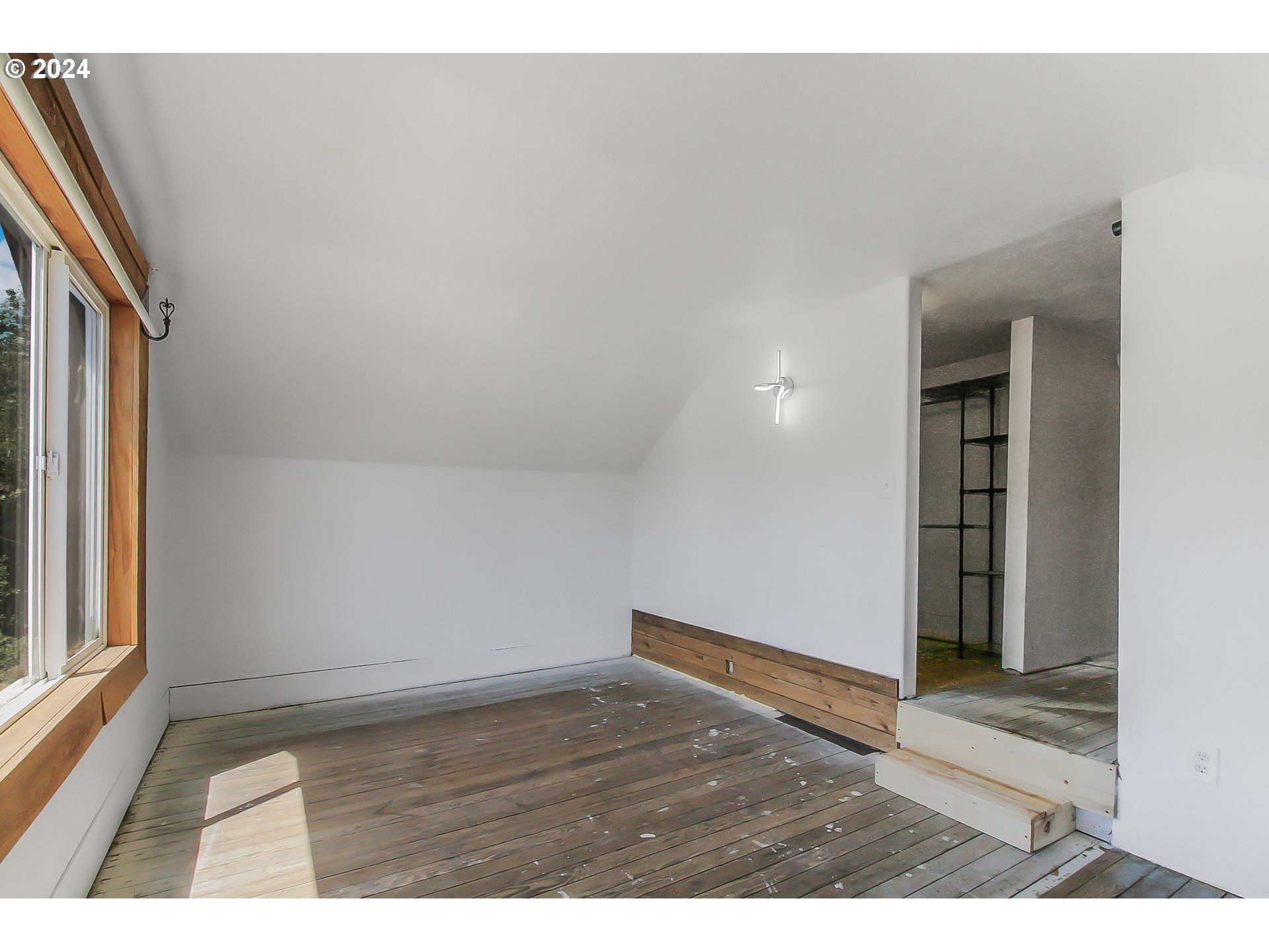 20239 Northwest Pihl Road Banks, OR 97106 - Photo 22 of 35 a view of an empty room and wooden floor