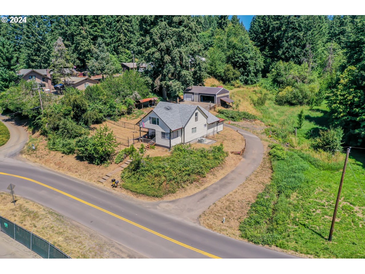 20239 Northwest Pihl Road Banks, OR 97106 - Photo 3 of 35 a view of a garden with a houses