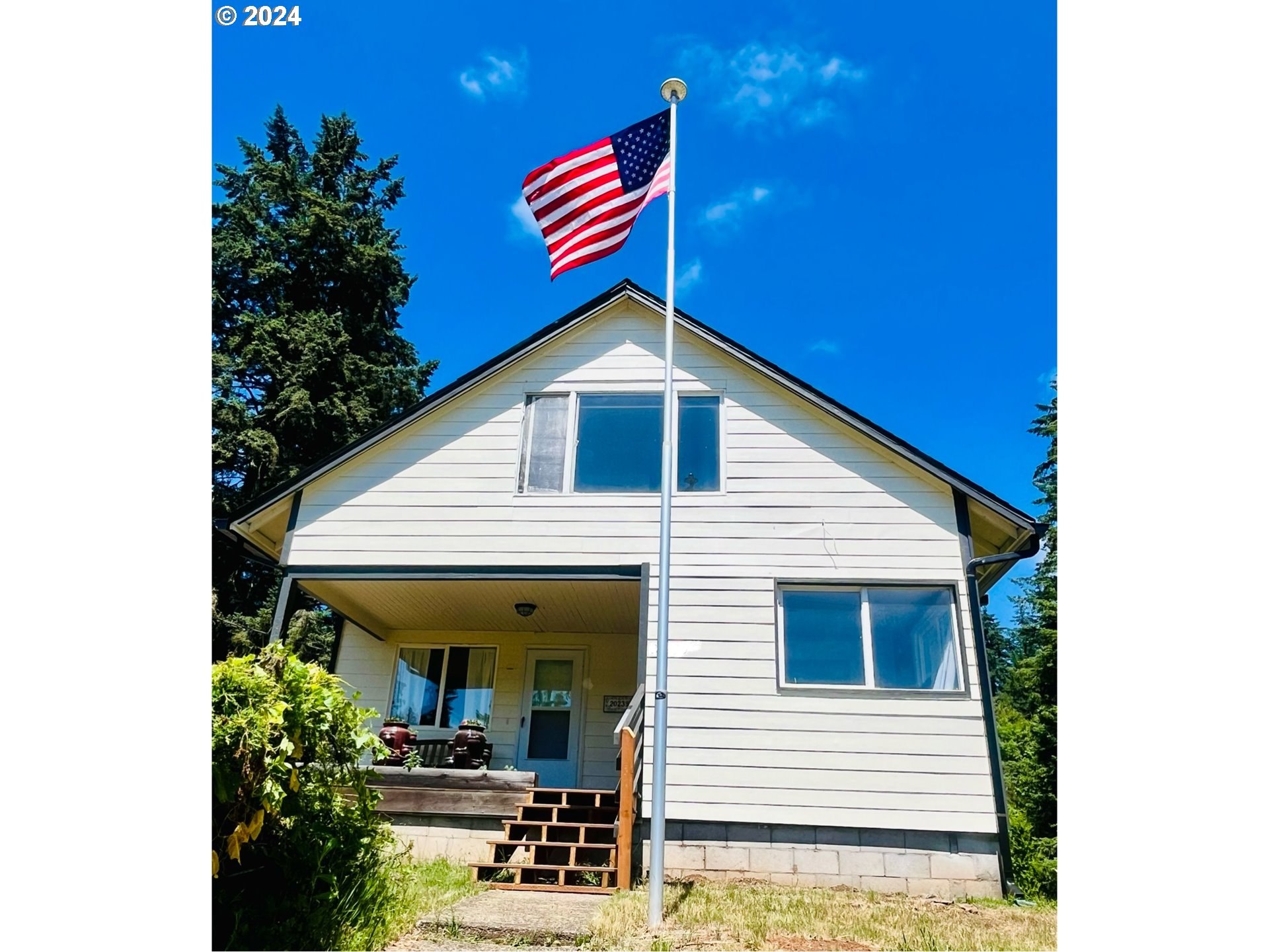 20239 Northwest Pihl Road Banks, OR 97106 - Photo 4 of 35 a front view of a house with garden