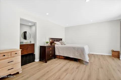 a bedroom with a bed and a dresser