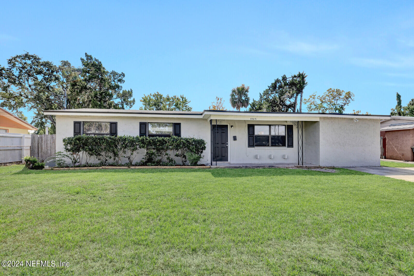 4503 Barnes Road South Jacksonville, FL 32207 - Photo 3 of 24 a front view of a house with garden