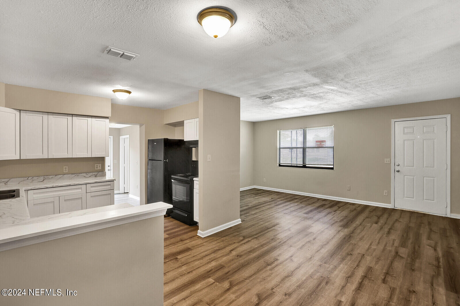 4503 Barnes Road South Jacksonville, FL 32207 - Photo 5 of 24 a view of a kitchen with a sink dishwasher stove top oven and cabinets