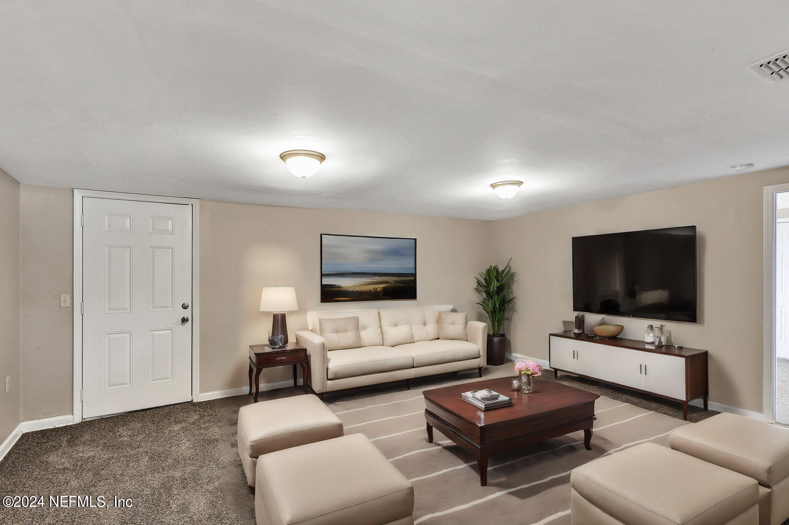4503 Barnes Road South Jacksonville, FL 32207 - Photo 10 of 24 a living room with furniture and a flat screen tv