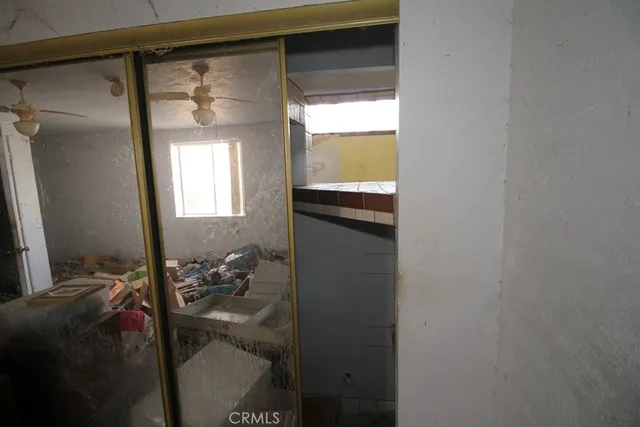 a room with furniture a rug and gym equipment