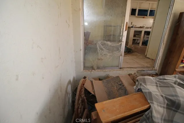 a room with furniture a rug and a window