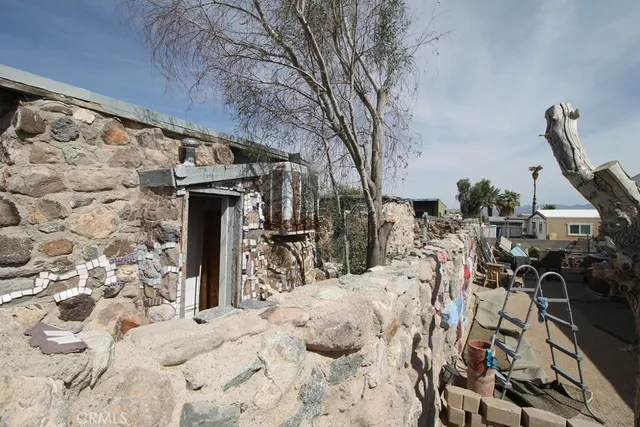 a view of a backyard with chairs