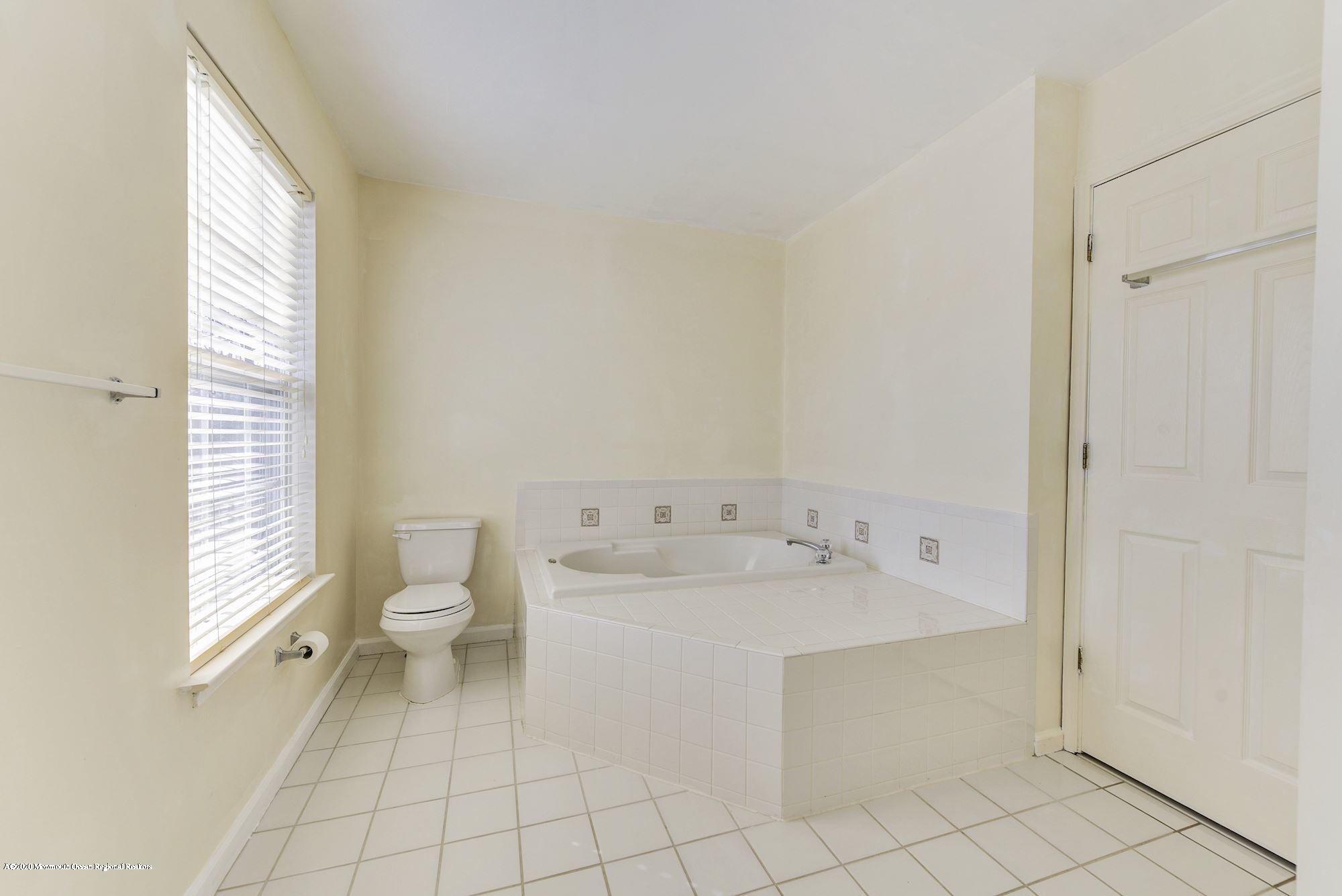 934 Hyson Road Jackson, NJ 08527 - Photo 26 of 43 a view of a bathroom with a sink and a toilet