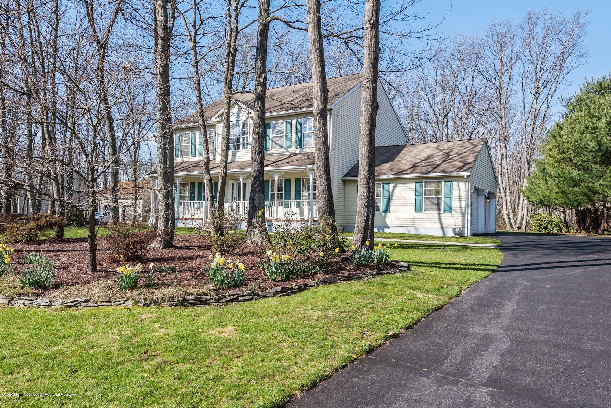 934 Hyson Road Jackson, NJ 08527 - Photo 3 of 43 a front view of a house with a yard