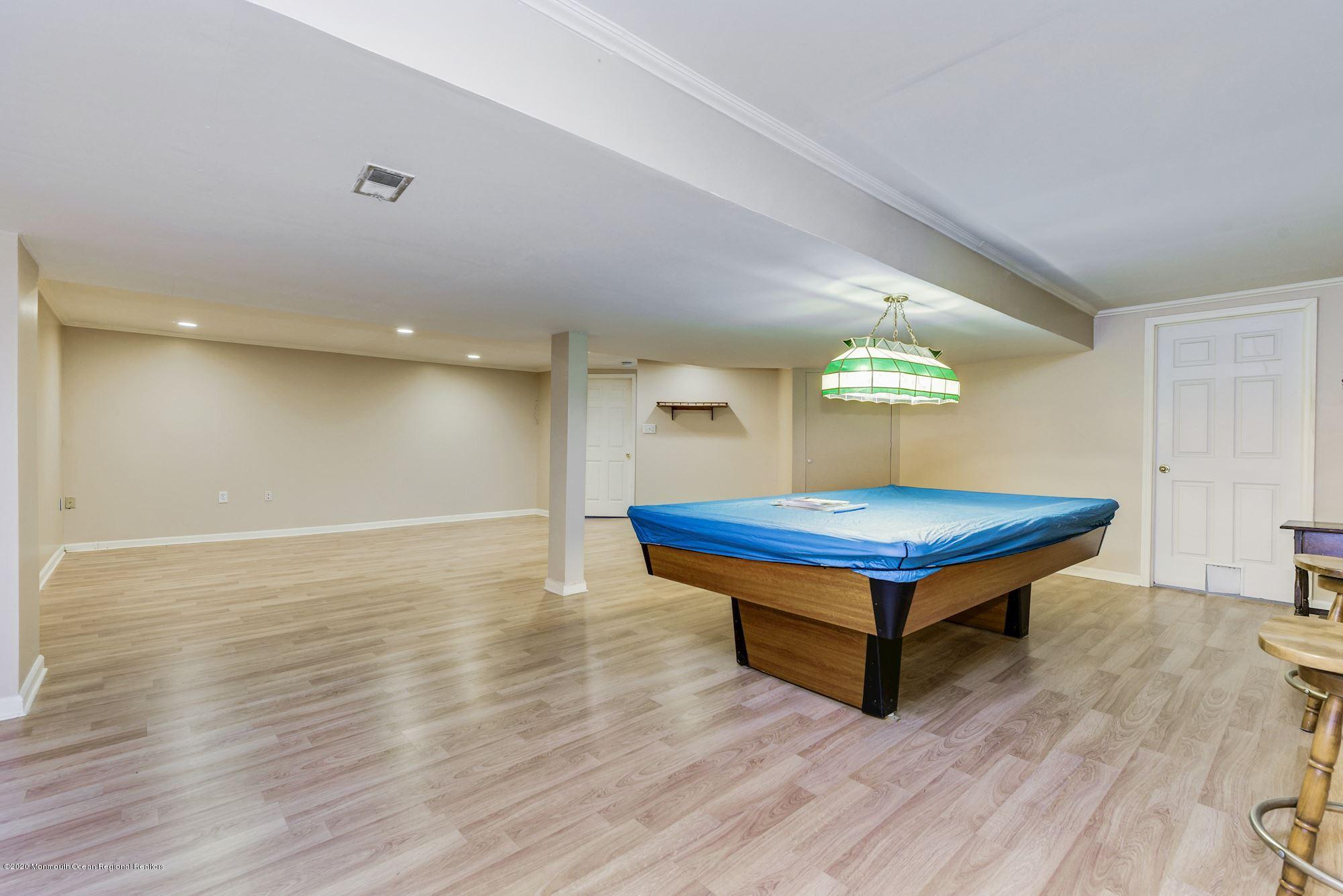 934 Hyson Road Jackson, NJ 08527 - Photo 32 of 43 a room with pool table and wooden floor
