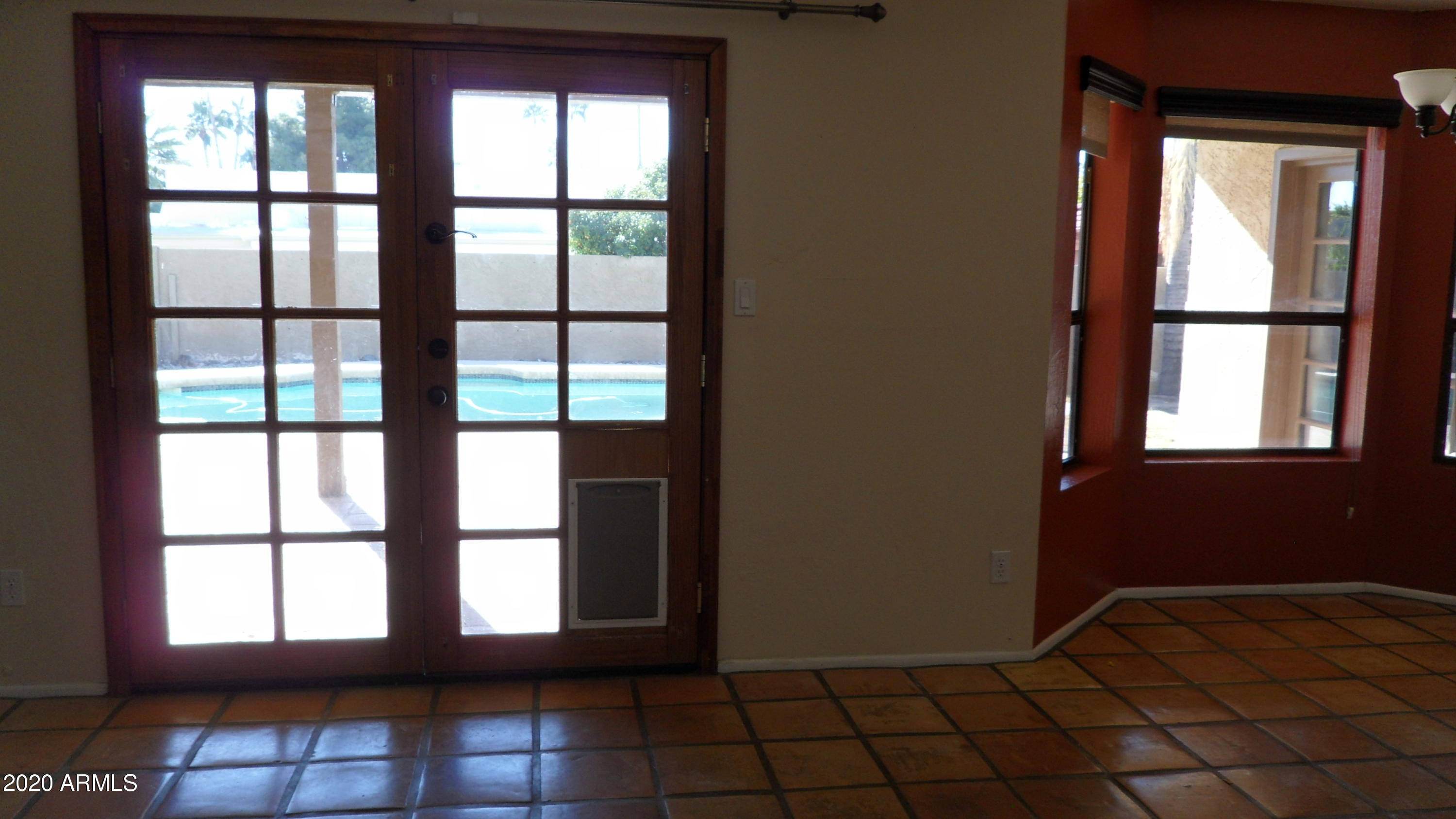 6935 East Hearn Road Scottsdale, AZ 85254 - Photo 5 of 19 FAMILY ROOM EXIT TO PATIO