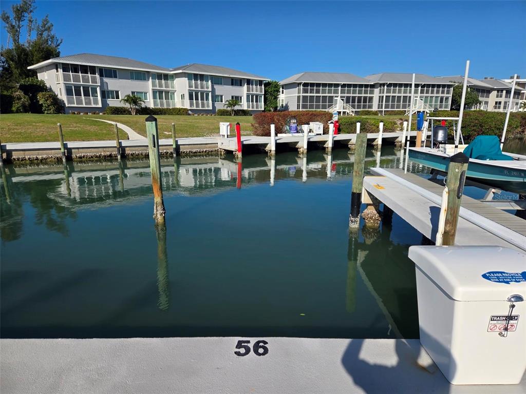5820 Gasparilla Road, Unit SLIP 56 Boca Grande, FL 33921 - Photo 2 of 10 a view of swimming pool with outdoor seating