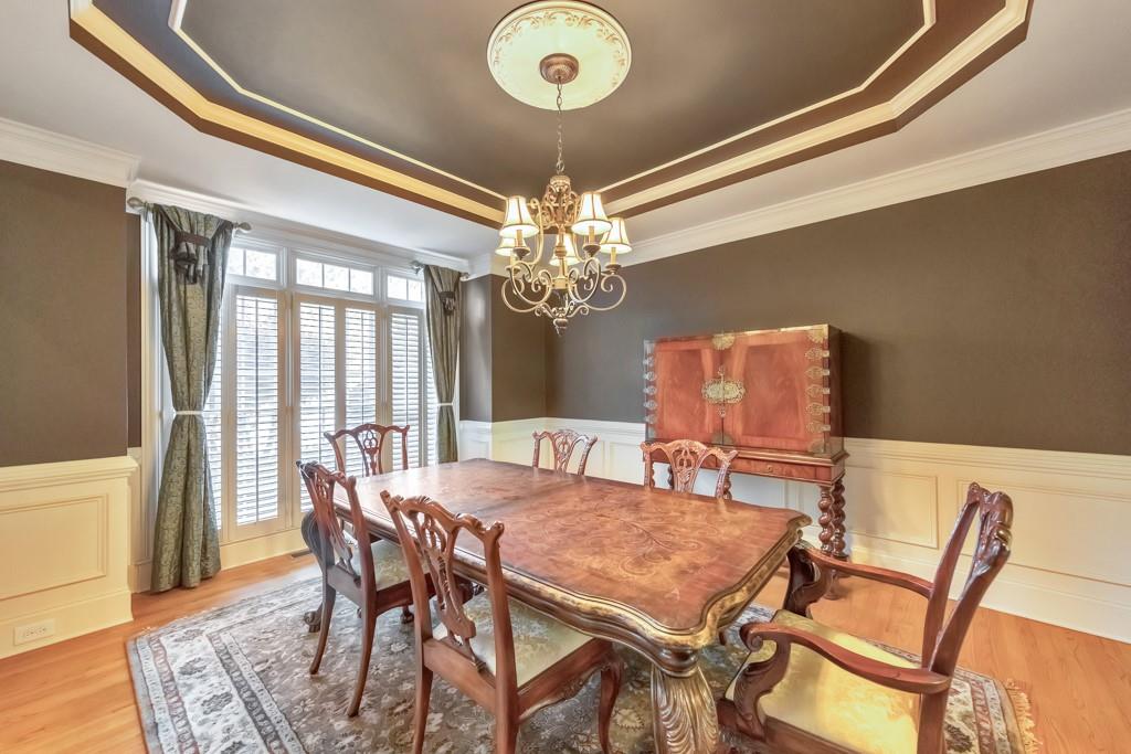 3161 Willowstone Drive Duluth, GA 30096 - Photo 12 of 72 a view of a dining room with furniture and chandelier