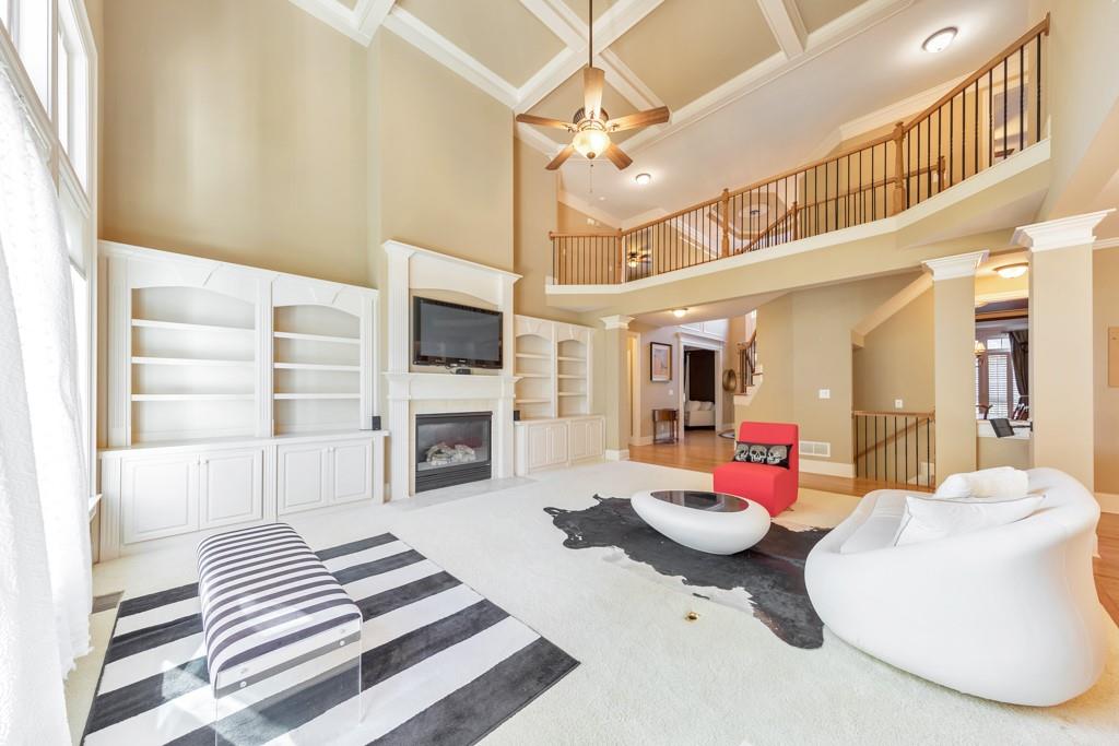 3161 Willowstone Drive Duluth, GA 30096 - Photo 15 of 72 a living room with furniture a flat screen tv and kitchen view