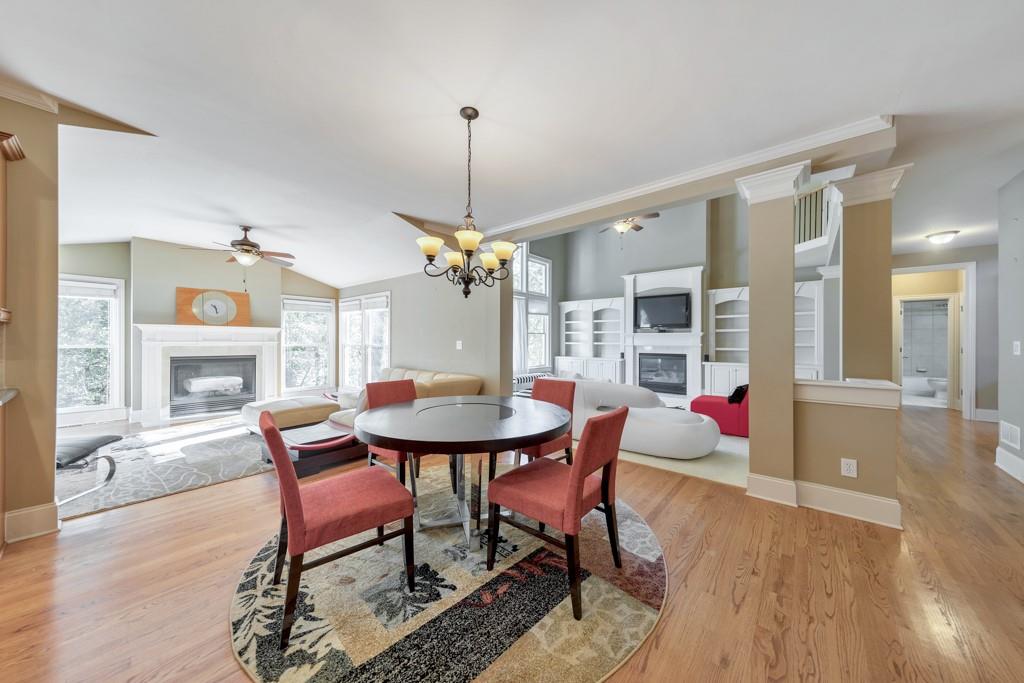 3161 Willowstone Drive Duluth, GA 30096 - Photo 18 of 72 a view of a dining room with furniture and wooden floor