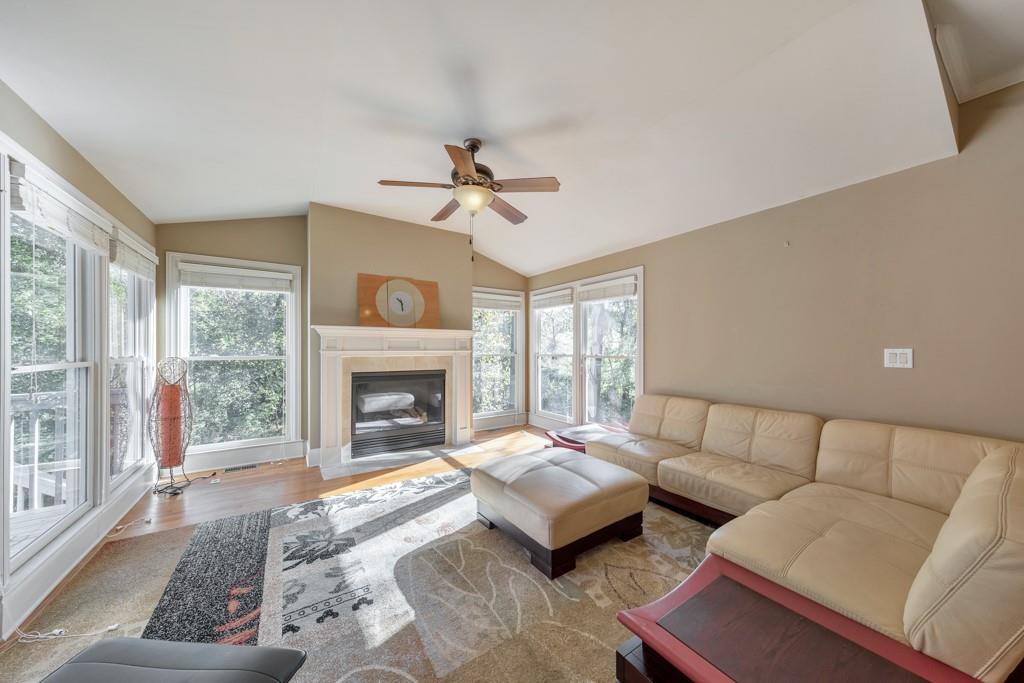 3161 Willowstone Drive Duluth, GA 30096 - Photo 19 of 72 a living room with furniture and a fireplace