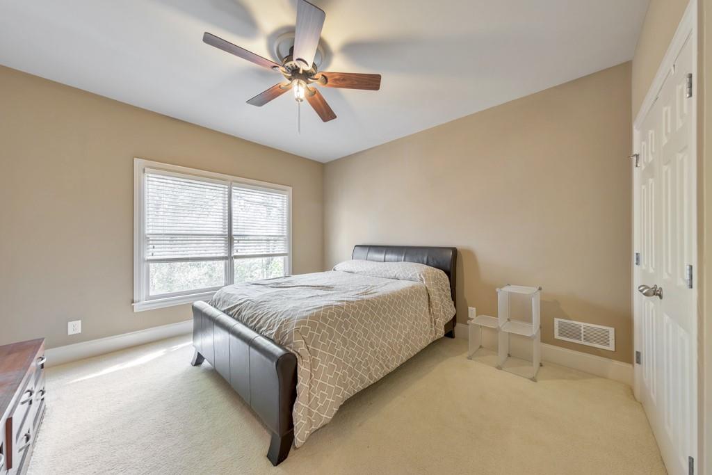 3161 Willowstone Drive Duluth, GA 30096 - Photo 26 of 72 a spacious bedroom with a bed and a window