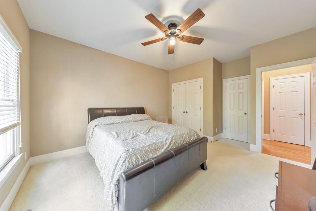 3161 Willowstone Drive Duluth, GA 30096 - Photo 27 of 72 a spacious bedroom with a bed and a large window