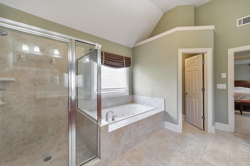 3161 Willowstone Drive Duluth, GA 30096 - Photo 33 of 72 a bathroom with a mirror and a shower