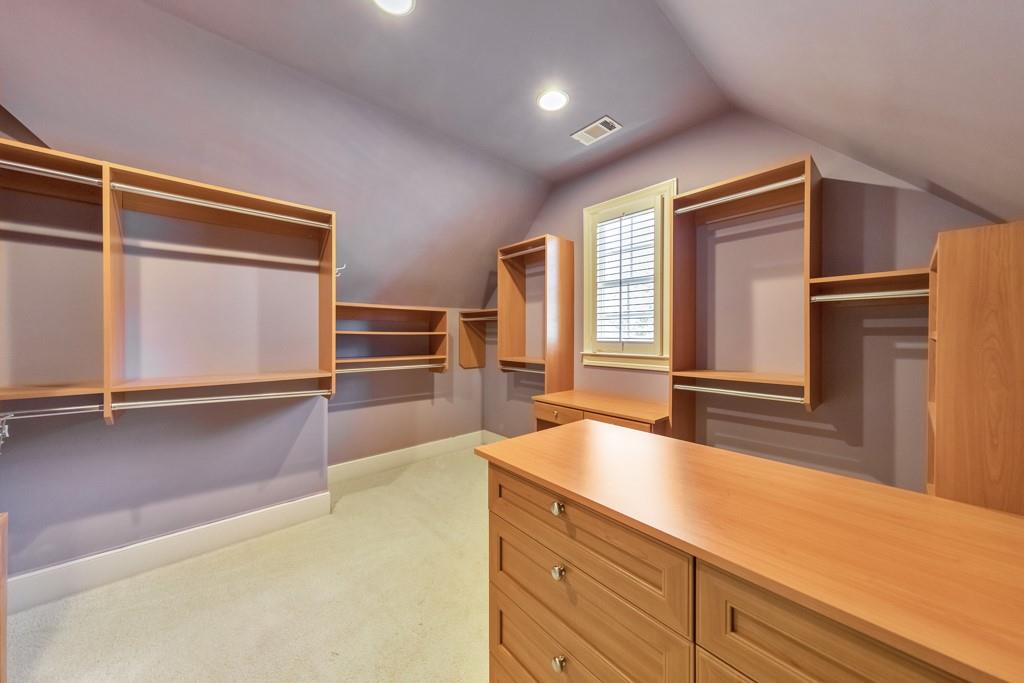 3161 Willowstone Drive Duluth, GA 30096 - Photo 35 of 72 a living room with stainless steel appliances kitchen island granite countertop wooden floor and cabinets