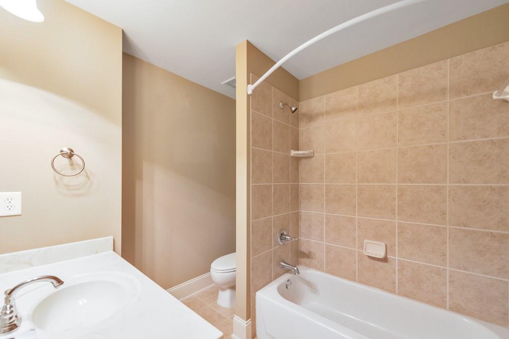 3161 Willowstone Drive Duluth, GA 30096 - Photo 39 of 72 a bathroom with a sink a toilet and shower