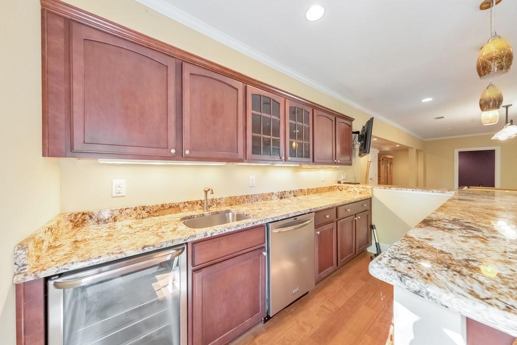 3161 Willowstone Drive Duluth, GA 30096 - Photo 50 of 72 a kitchen with granite countertop sink stove and cabinets