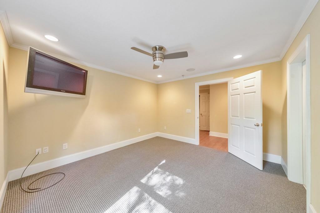 3161 Willowstone Drive Duluth, GA 30096 - Photo 56 of 72 a view of a livingroom with a chandelier fan and wooden floor