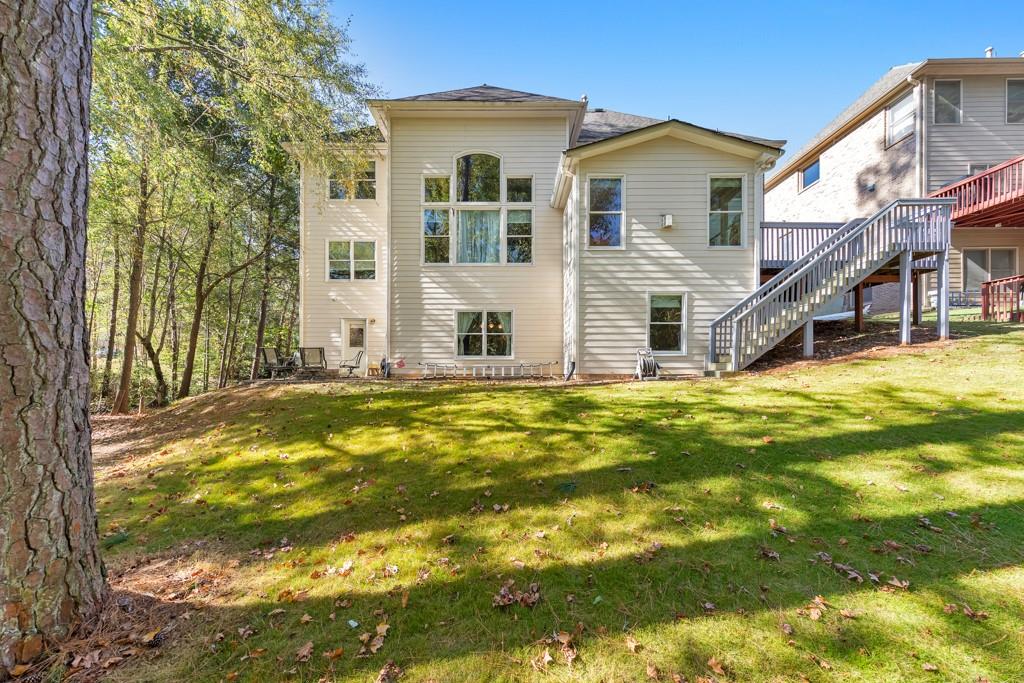 3161 Willowstone Drive Duluth, GA 30096 - Photo 61 of 72 a house view with swimming pool in front of it