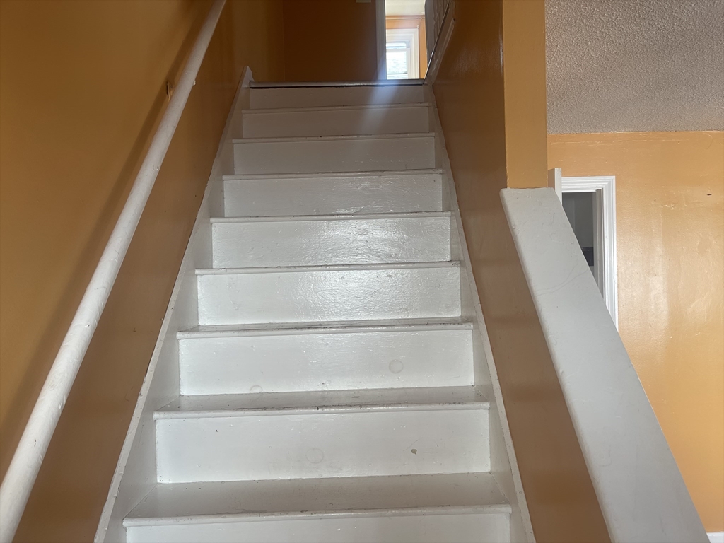 5 Tower Street Methuen, MA 01844 - Photo 6 of 9 a view of staircase with white walls