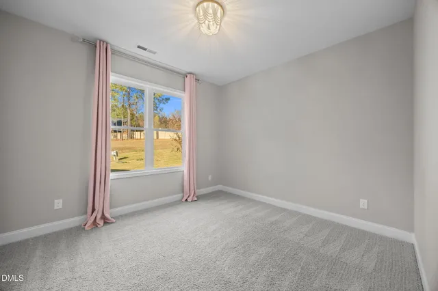 an empty room with a empty space and a window