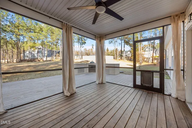 a view of a hardwood floor and a window